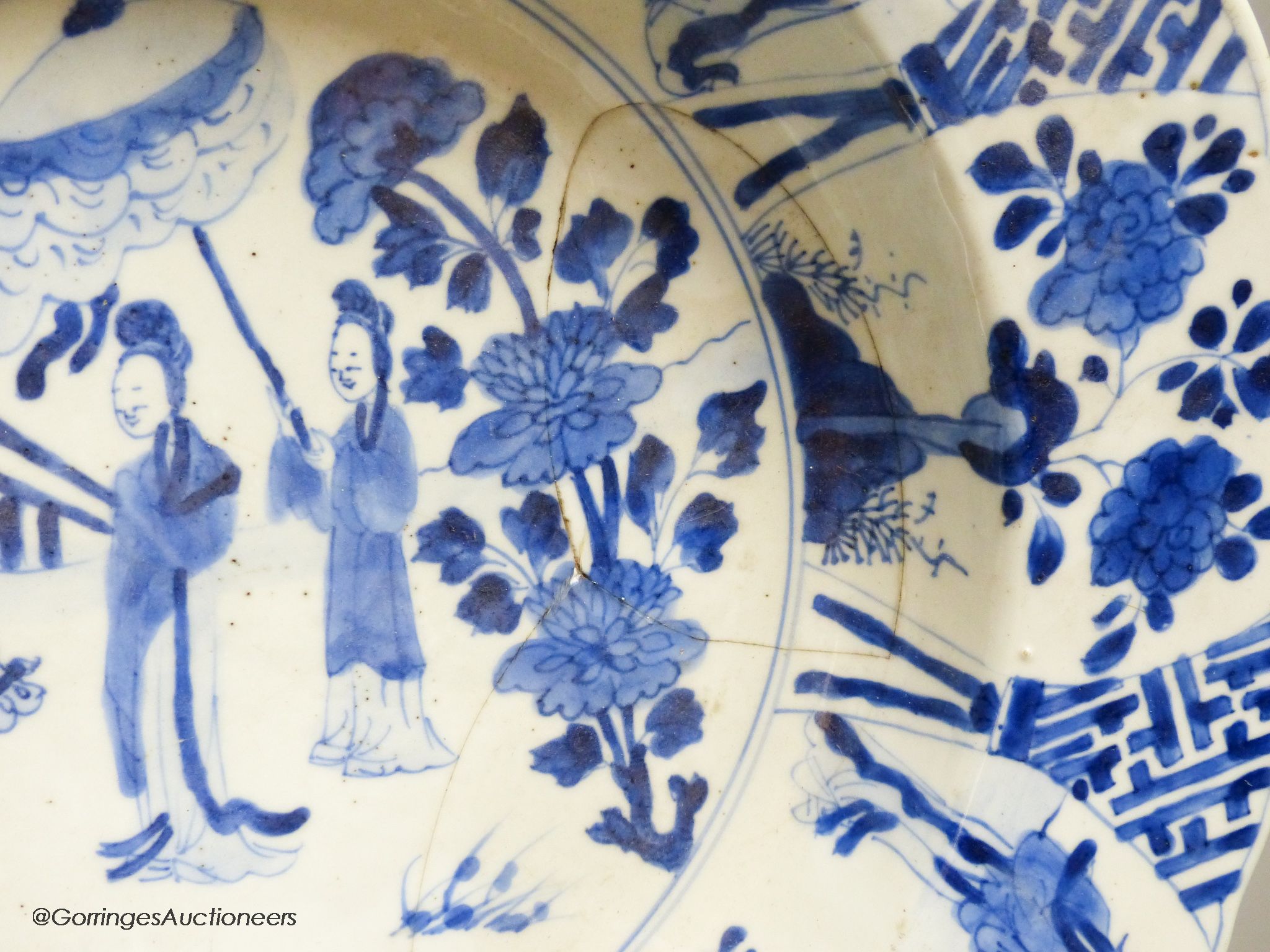 A Chinese blue and white dish, Kangxi mark and of the period, diameter 34cm, and a 19th century Chinese blue and white jar